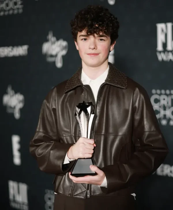 Owen Cooper wearing a brown jacket front view at Critics Choice Awards