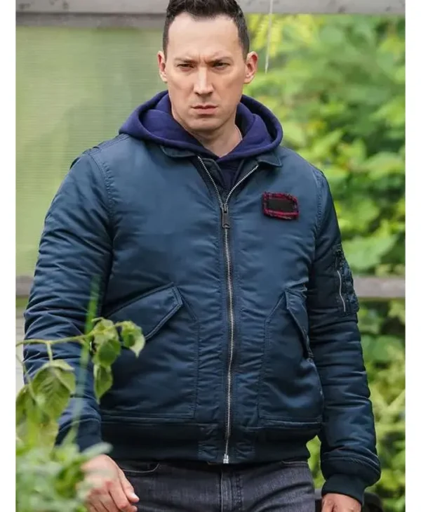 Jack Hodgson wearing a blue bomber jacket front view from Silent Witness