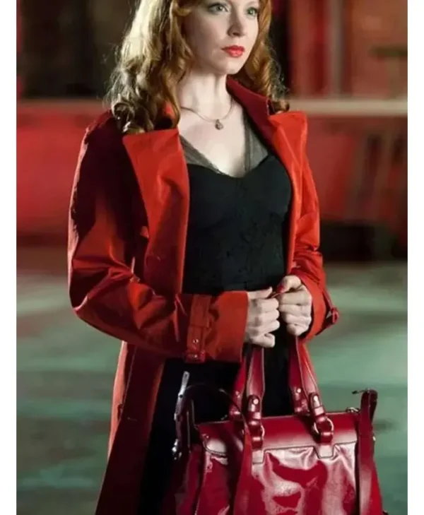 Jilly Kitzinger wearing a red coat front view in Torchwood