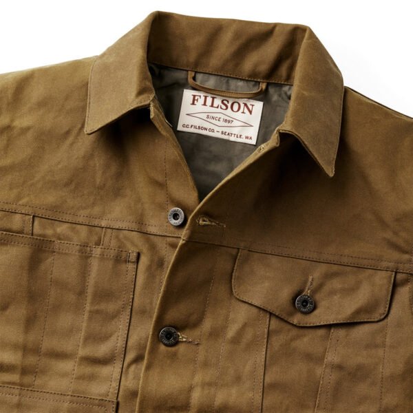 Side profile showing the button cuffs and soft interior lining.